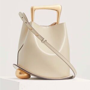 White (crema)  leather bag with golden allure